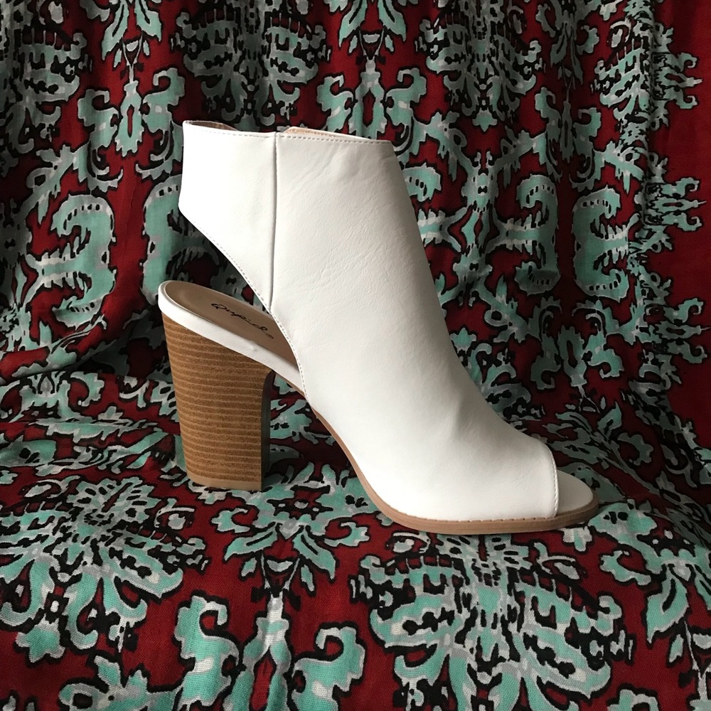 Women’s white leather zip bootie.